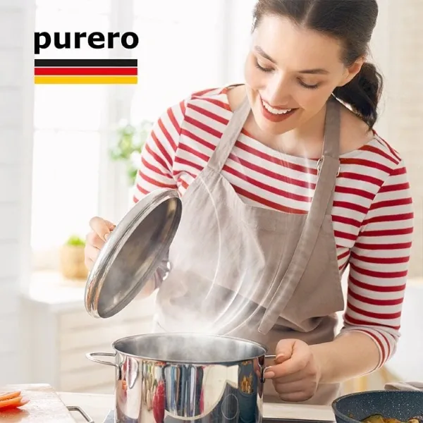 Lifestyle-Bild für purero Dunstabzugshauben-Filter mit Frau beim Kochen in einer frischen, geruchsfreien Küche